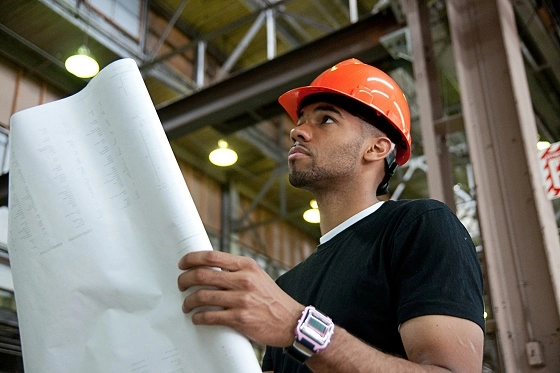 man with blueprint